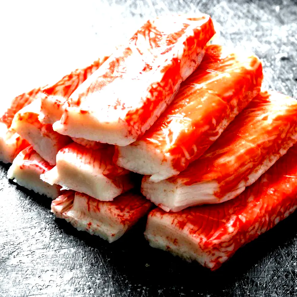 Imitation crab sticks surimi seafood stacked fresh for wholesale distribution