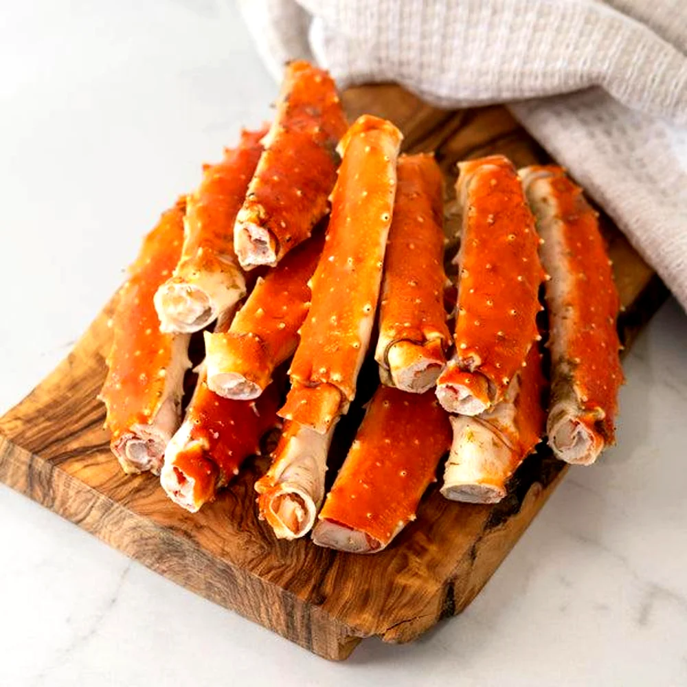 Fresh premium king crab legs stacked for wholesale seafood supply