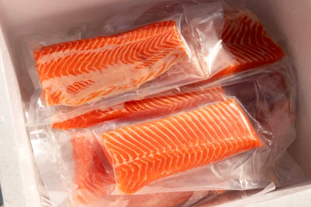 Vacuum packed Atlantic salmon fillets prepared for frozen seafood wholesale supply and export